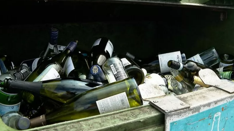 A recycling bank full of glass bottles