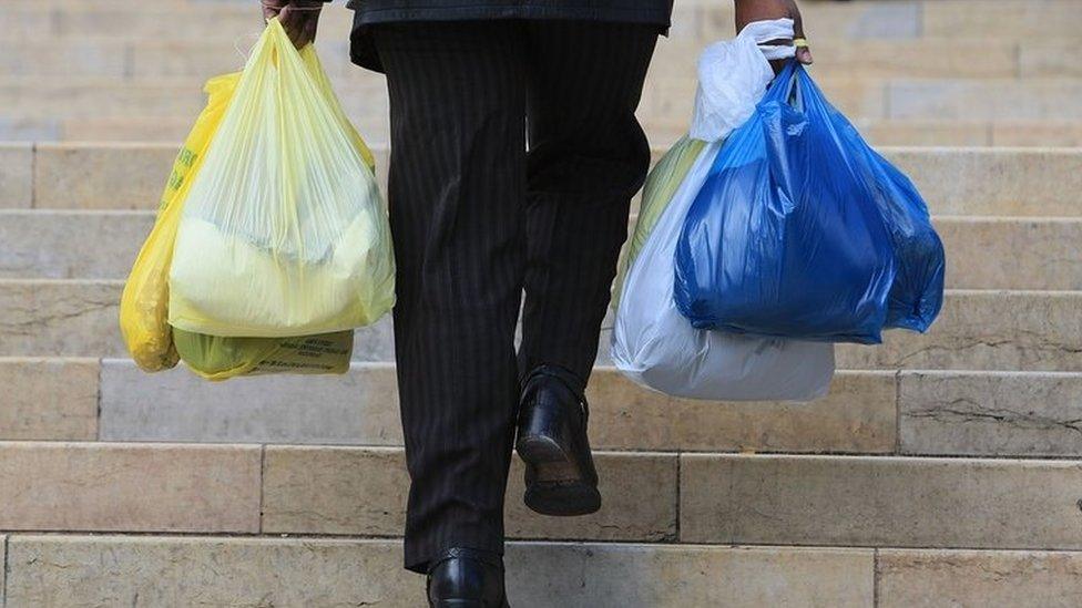 Man carrying shopping bags