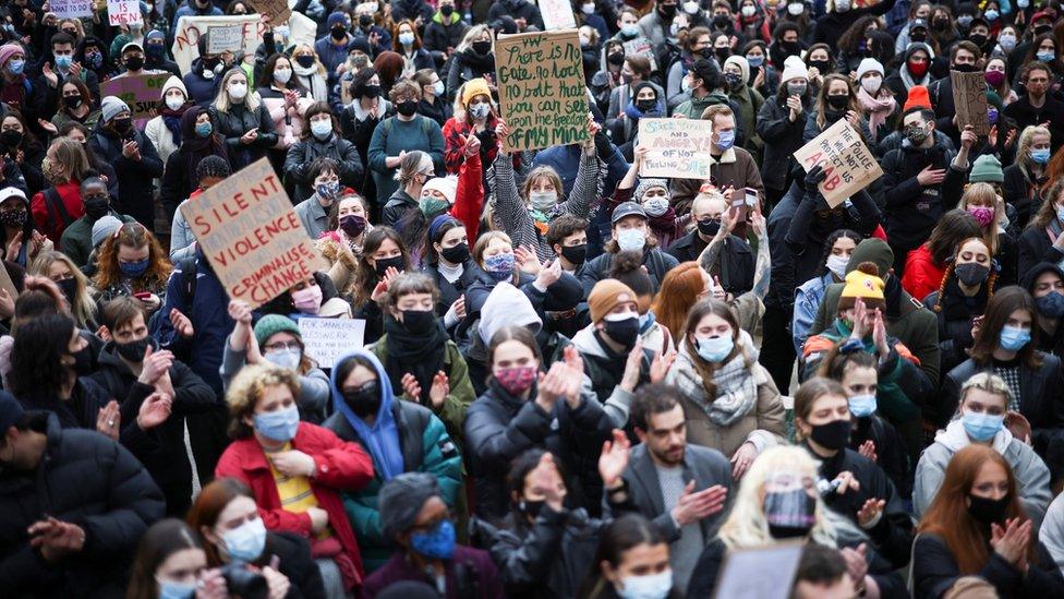 People attend a protest at Parliament Square, central London