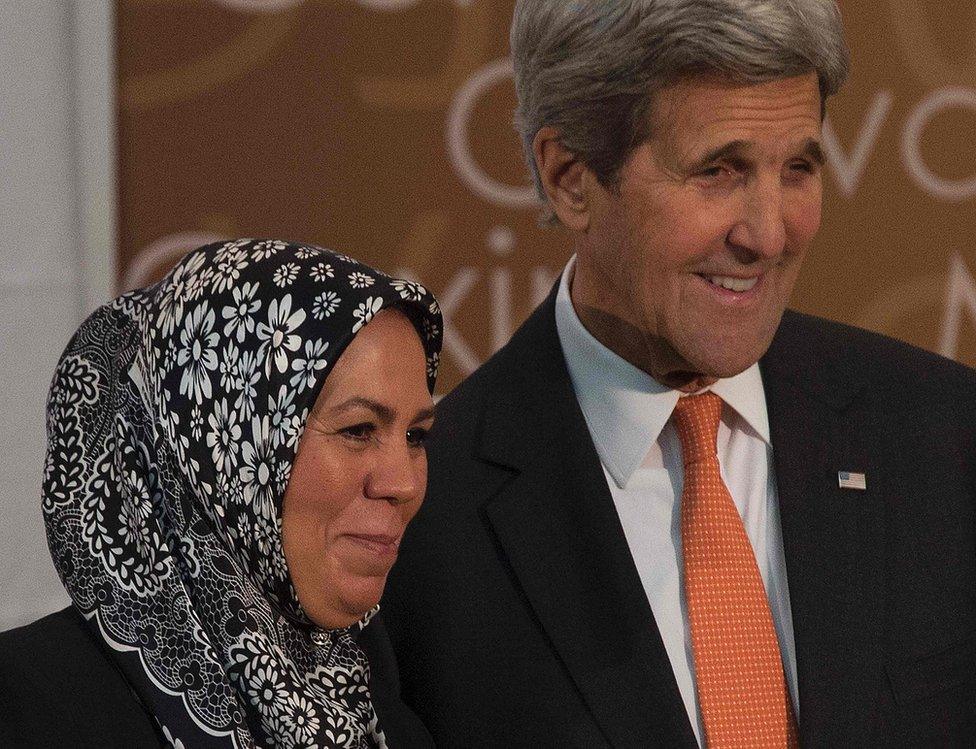 French recipient of the 2016 International Women of Courage Award, Latifa Ibn Ziaten (L), poses with US Secretary of State John Kerry at the State Department in Washington, DC, March 29, 2016