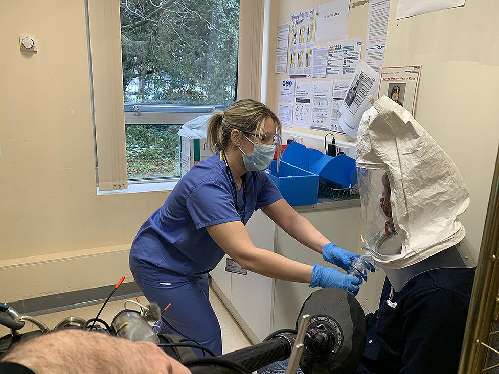 Presenter Ben is fitted with PPE