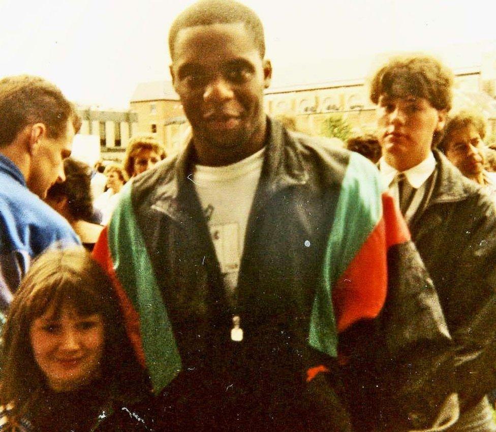 Dalian Atkinson with a young fan