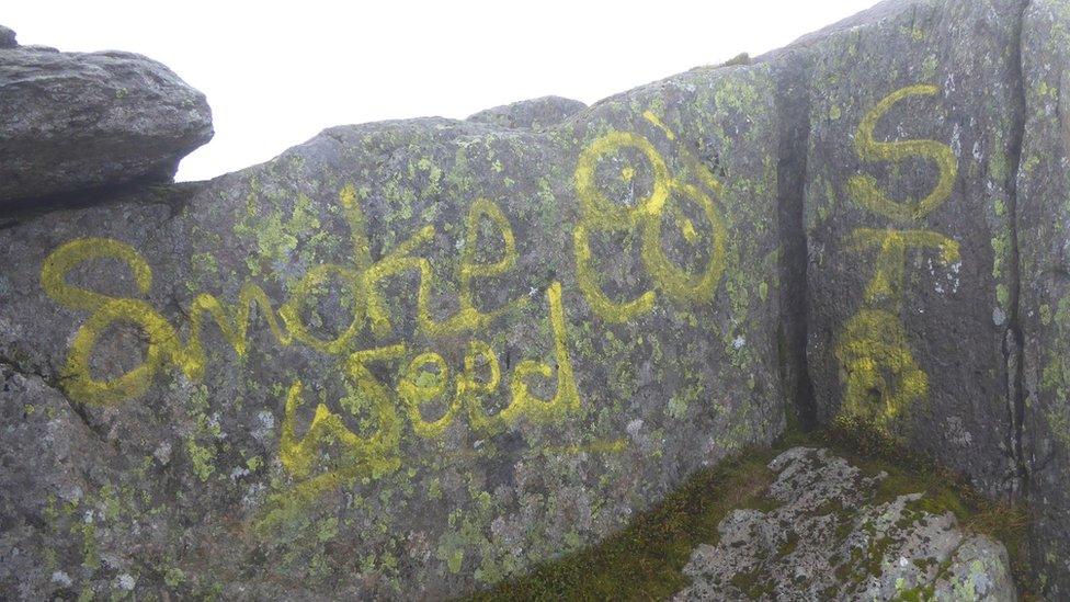 Smoke Weed slogan painted on rocks below south summit of Tryfan