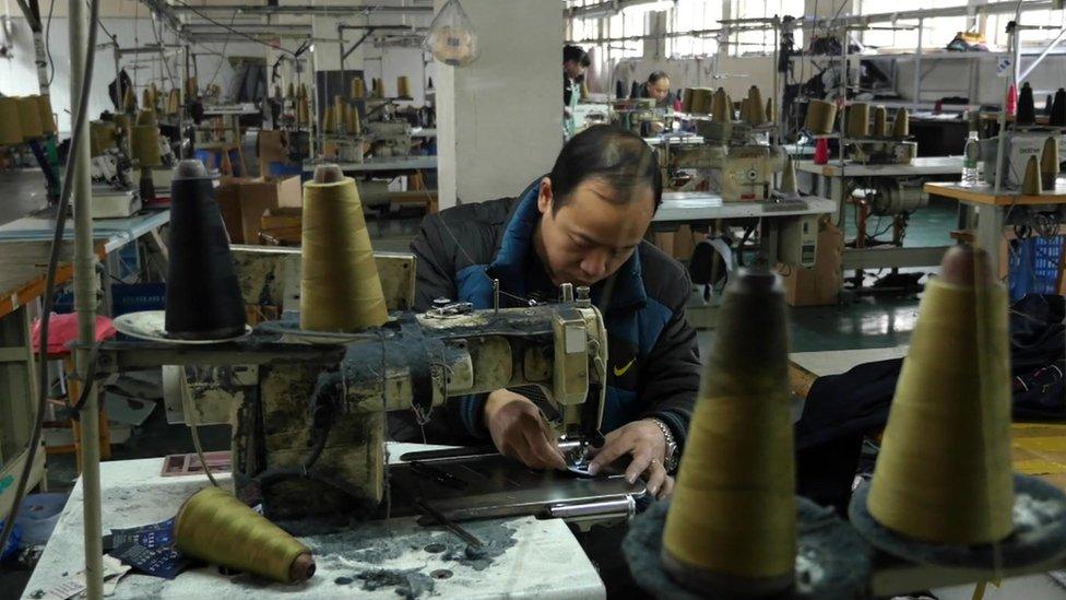 Tang Yujun working at his factory in Chengdu