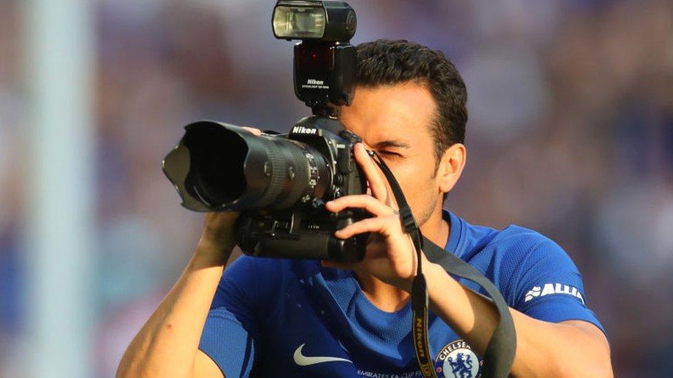 Pedro of Chelsea takes a photo with a camera after The Emirates FA Cup Final between Chelsea and Manchester United at Wembley Stadium on May 19, 2018 in London, England.