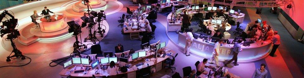 A general view shows the newsroom at the headquarters of the Qatar-based Al-Jazeera satellite news channel in Doha 14 November 2006.