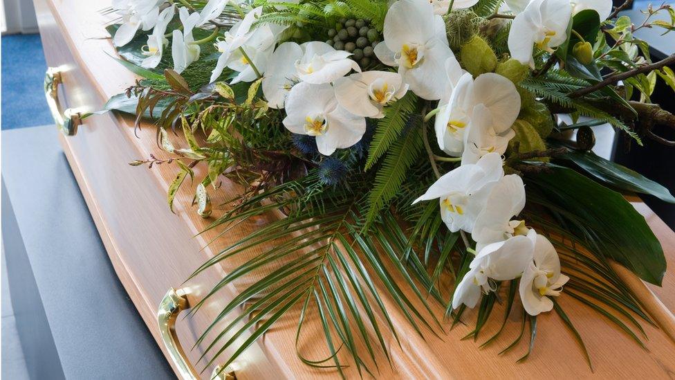 Flowers on coffin