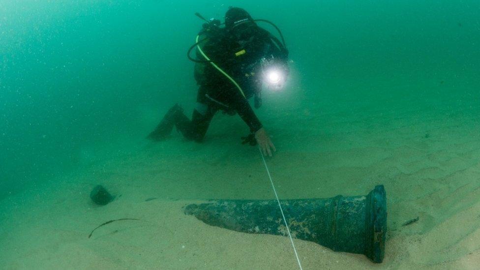 A diver works at the scene of a centuries-old shipwreck near Portugal