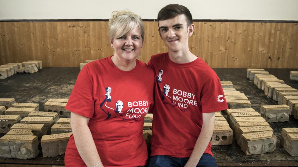 Jonjo and his mother Donna with the commemorative bricks