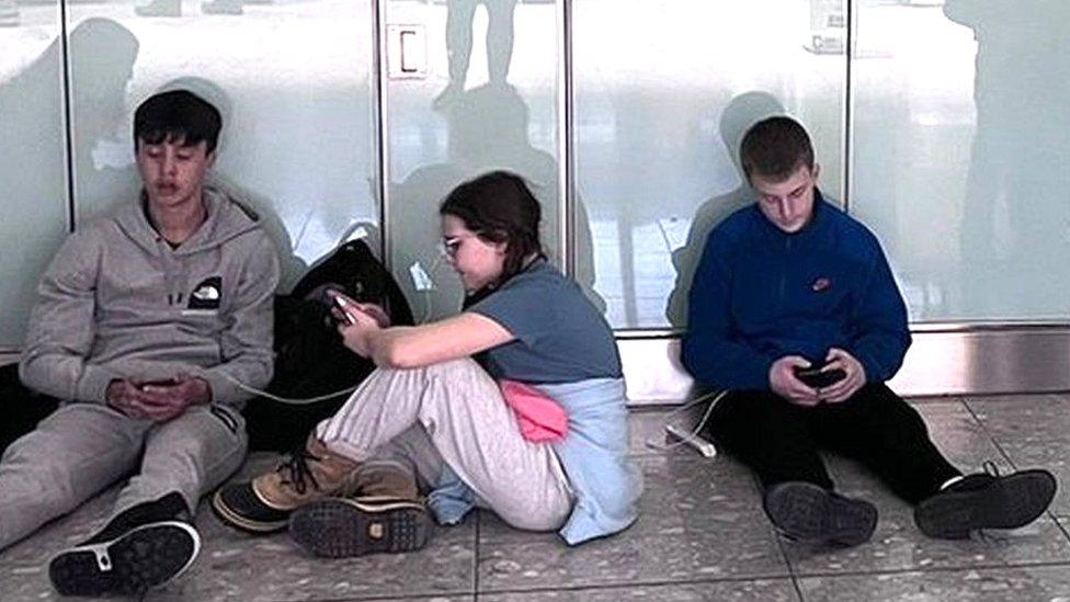 Part of the group from Llantrisant, South Wales, waiting around at Heathrow last week