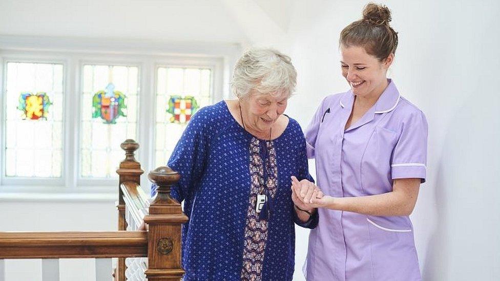 Carer and elderly woman