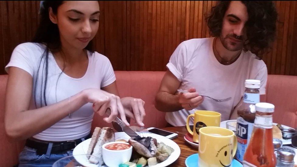 Young couple eating breakfast