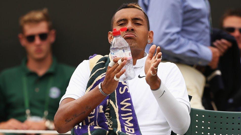 Nick Kyrgios of Australia takes a drink during a break in play in his Gentlemen's Singles Fourth Round match against Richard Gasquet of France during day seven of the Wimbledon Lawn Tennis Championships at the All England Lawn Tennis and Croquet Club on July 6