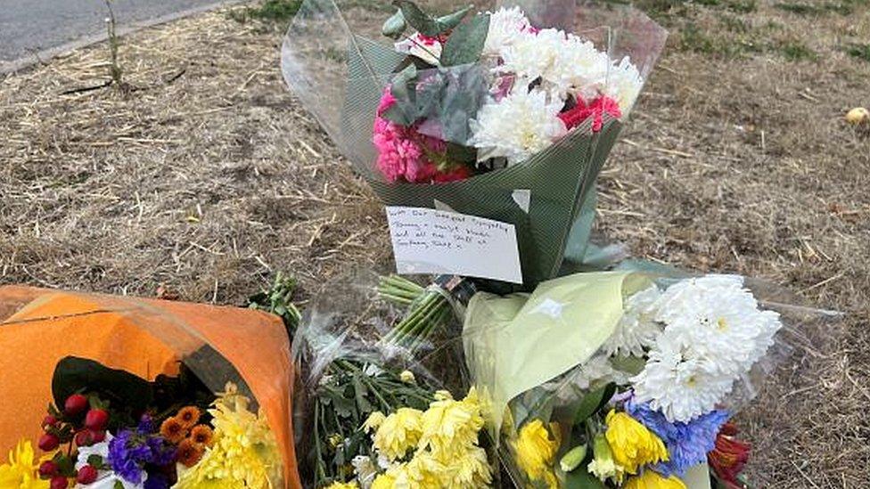 Flowers left by a junction following motorbike rider's death at the B1160 Lynn Road with Ferry Bank, Southery