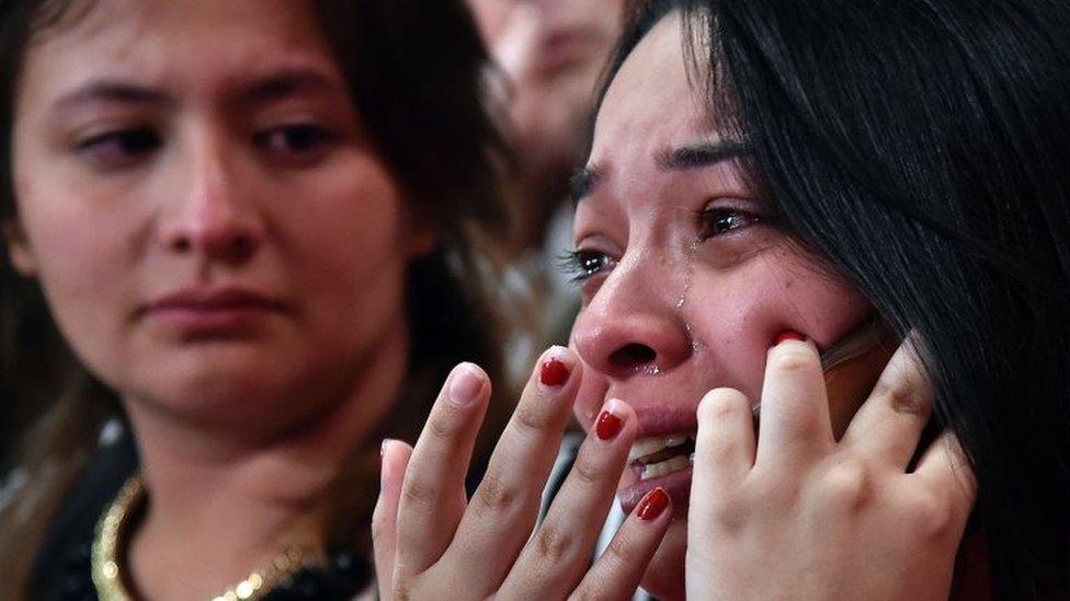 A woman cries as she speaks on her mobile phone after knowing the results of a referendum on whether to ratify a historic peace accord to end a 52-year war between the state and the communist FARC rebels, in Cali, Colombia, on October 2, 2016.