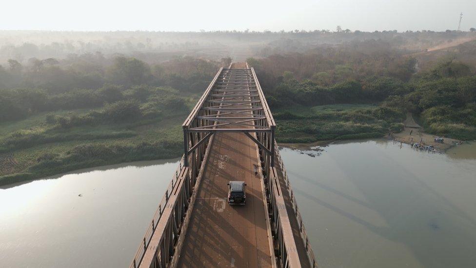 Car going over a bridge