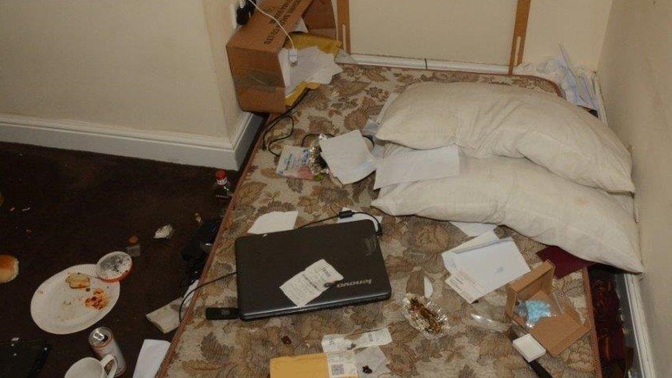 Bed covered in items at Ross Brennan's flat