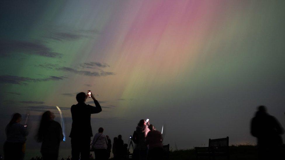 People visit St Mary's lighthouse in Whitley Bay to see the aurora borealis, commonly known as the northern lights