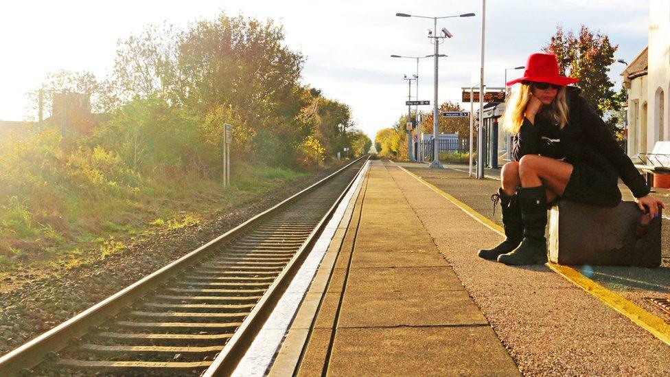 Woman at railway station