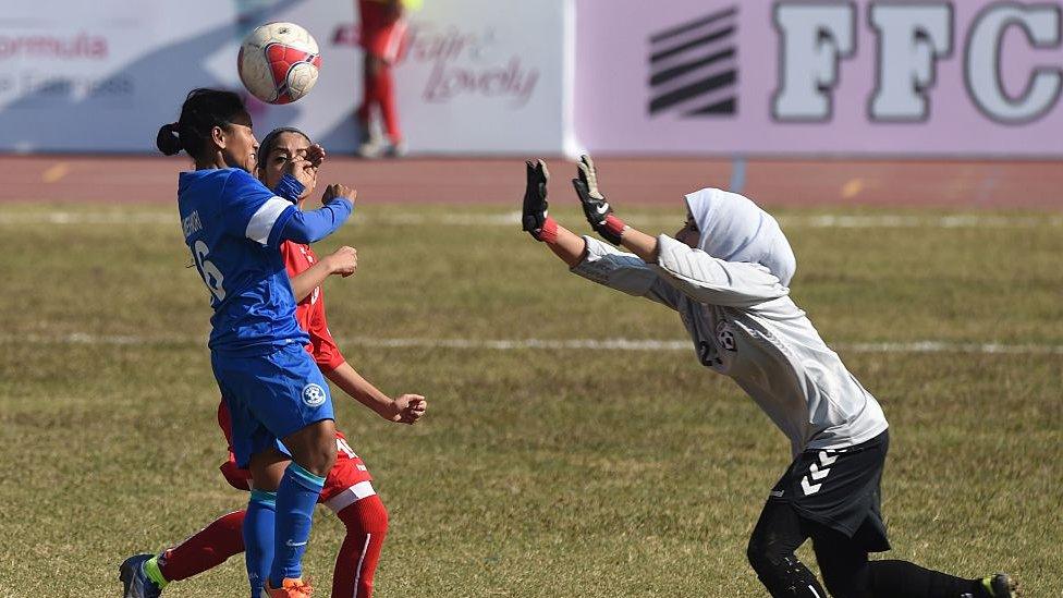 Women playing a football match in India