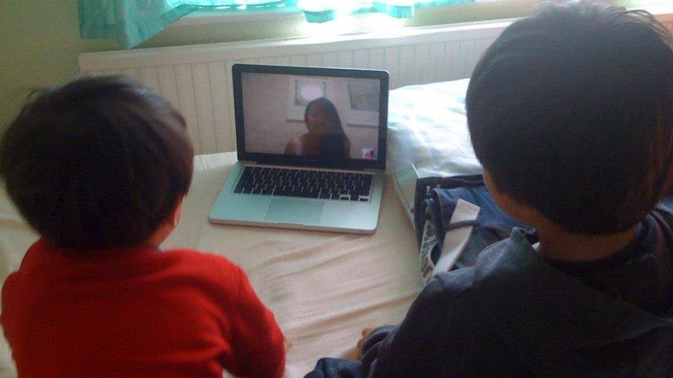 Molly Russell on the computer screen with her two sons