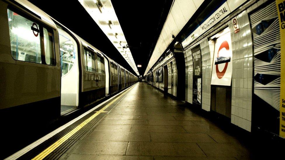 rain waiting at an empty platform.