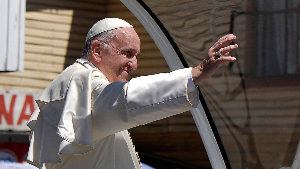 Pope Francis waves to the crowd while driving through Temuco, Chile, 17 January 2018