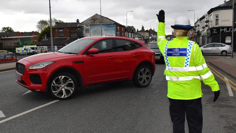 Police stopping cars in Bolton