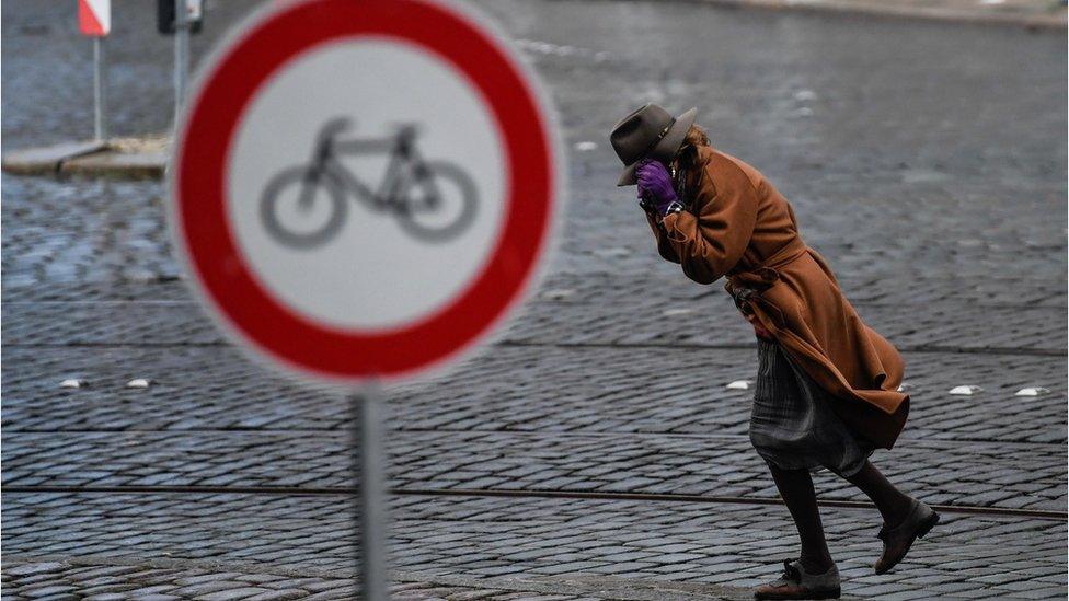 A woman walks through fierce winds during Friederike storm in Dresden , Germany, 18 January 2018.