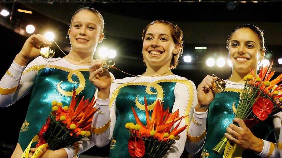 (L-R) Naomi Russell, Chloe Sims, and Monette Russo of Australia celebrate winning Gold in the Womens Artistic Gymnastics at the 2006 Commonwealth Games