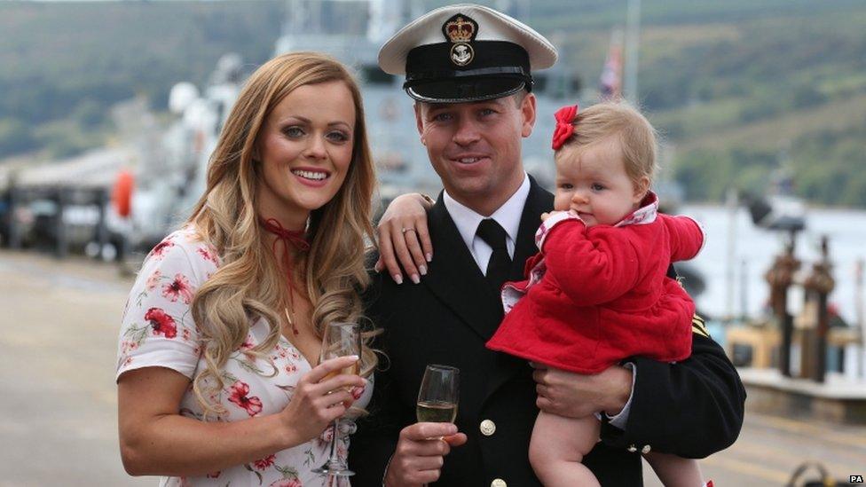 Petty Officer Mark Titman with his girlfriend Laura Campbell and daughter Ava