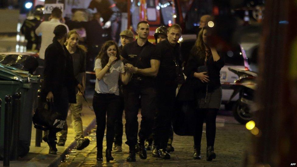 Police and rescuers work at the scene in Paris