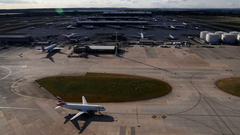 A plane taxis at London Heathrow Airport