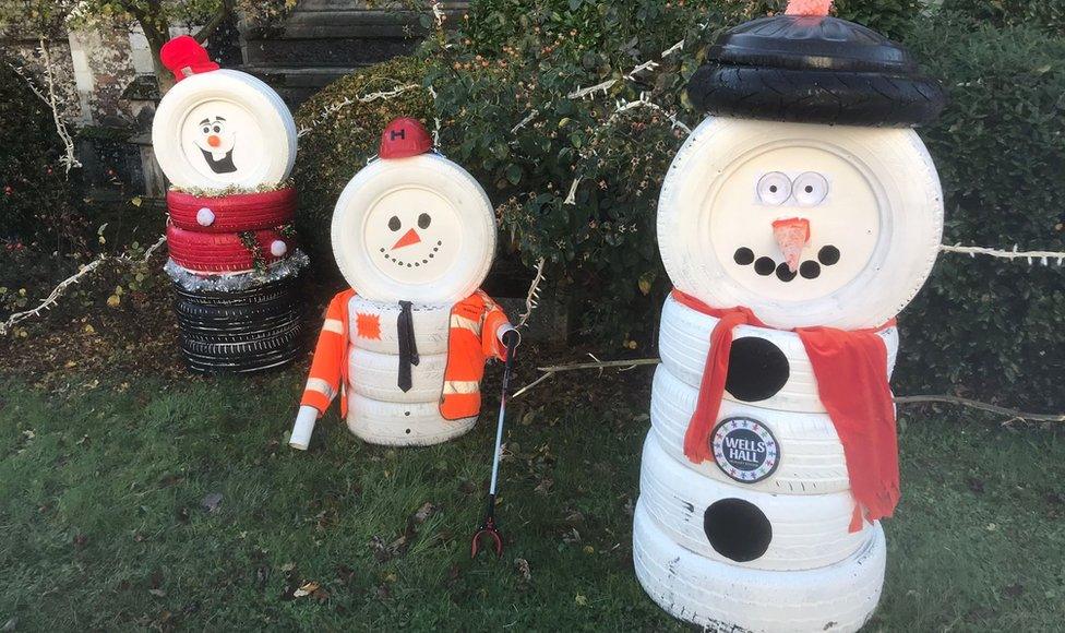 Snowmen made from old tyres in Sudbury