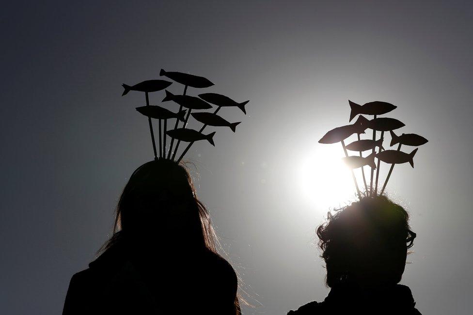 Women take part in the "Sardine Movement" rally in Rome, 14 December