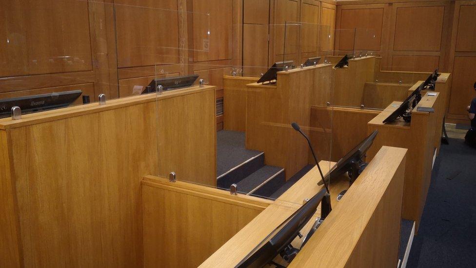 An example of the socially-distanced court room