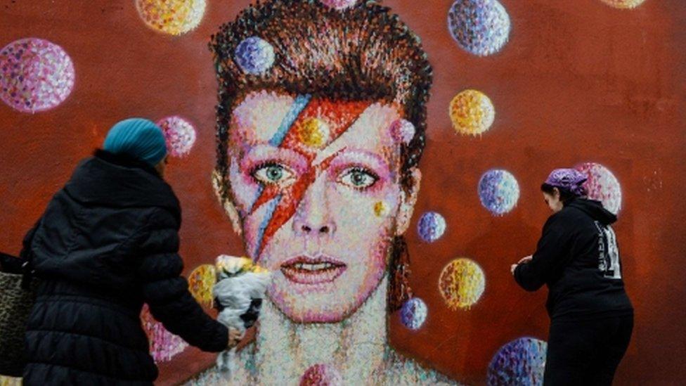 A mural of Bowie on the wall of a Morley's store in Brixton, London