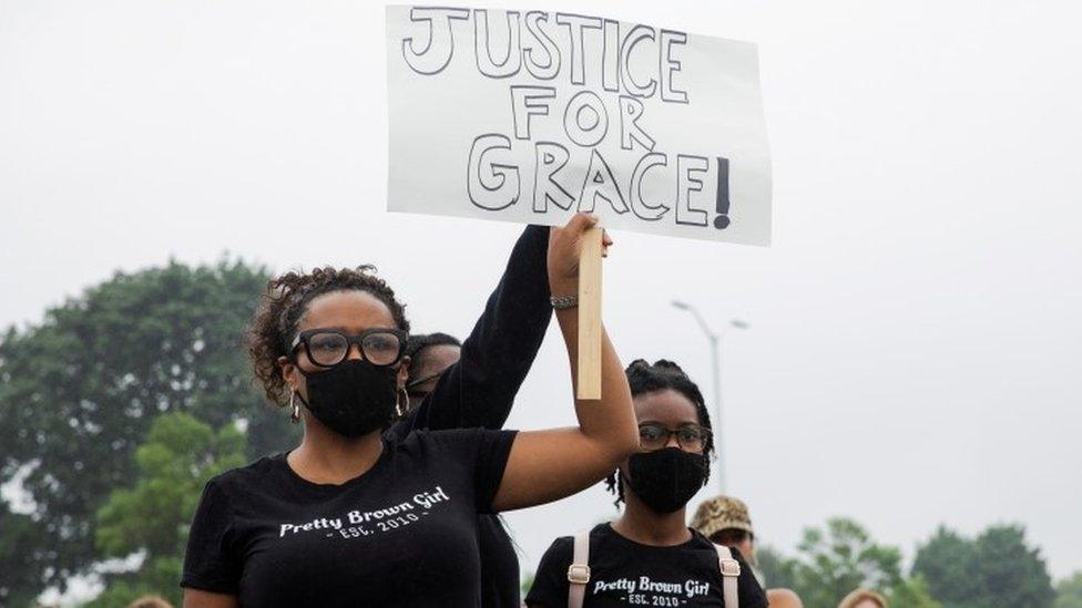 Protesters hold up a sign saying: Justice for Grace, at a rally in Pontiac, Detroit, on 16 July 2020