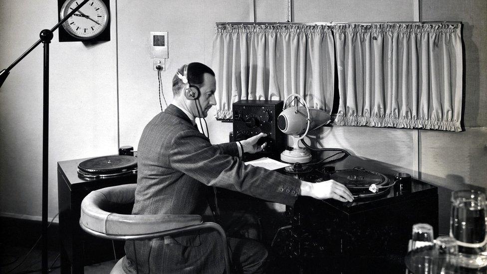 Operator at Broadcasting House with a bomb microphone