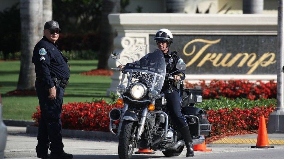 Police block off the entrance to the Trump National Doral Miami resort.