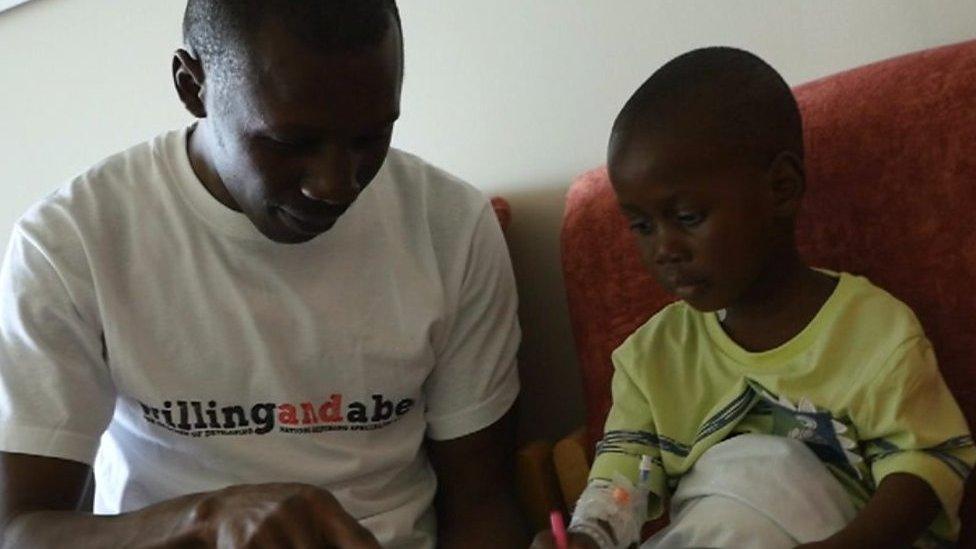 Ethan Suglo and his dad Charles