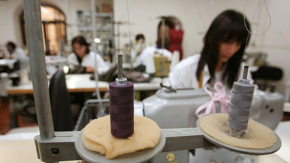 Dressmakers sew cashmere pieces in Italian luxury designer Brunello Cucinelli's factory in the medieval hilltop village of Solomeo