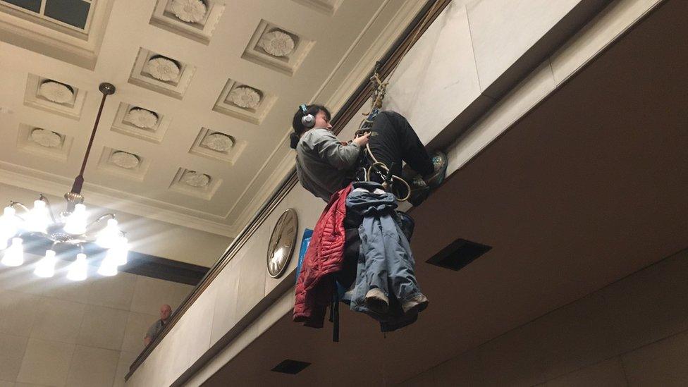 Cambridge City Council chamber and protesters