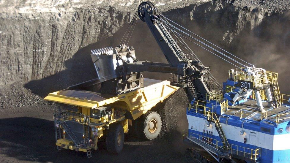 A mechanized shovel loads coal from an 80-feet thick seam into a haul truck at Cloud Peak Energys Spring Creek mine near Decker, Montana, November 2016