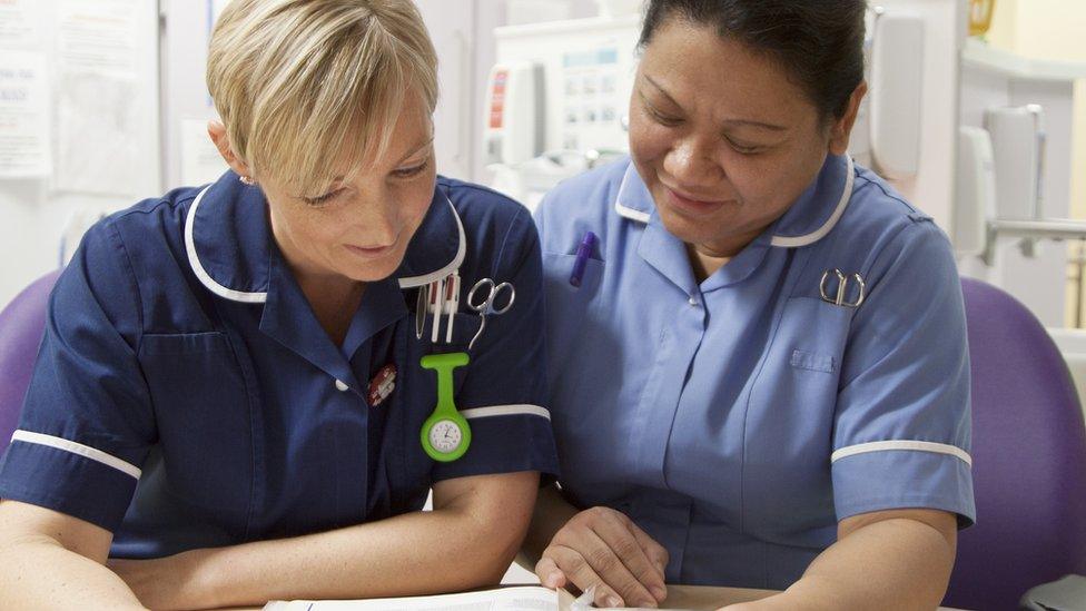 health workers on a ward