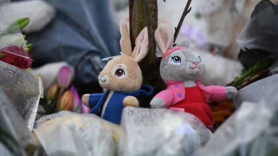 Soft toy tributes at scene of fire