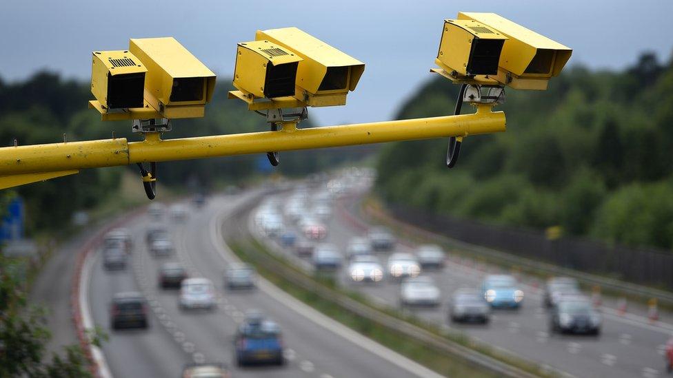 Cameras above a motorway