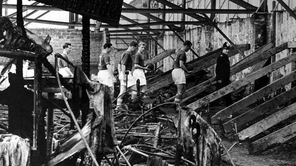 Leeds United Team surveying fire damage