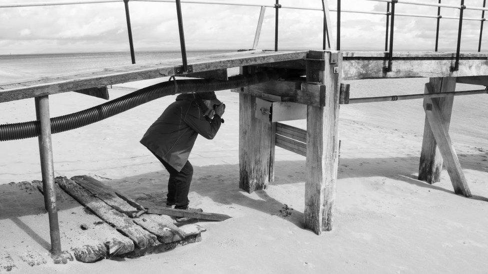 Local photographer Alan taking photograph on a walk in Fleetwood