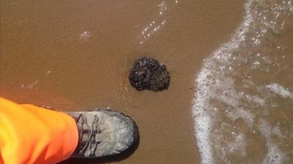 Tar ball on beach